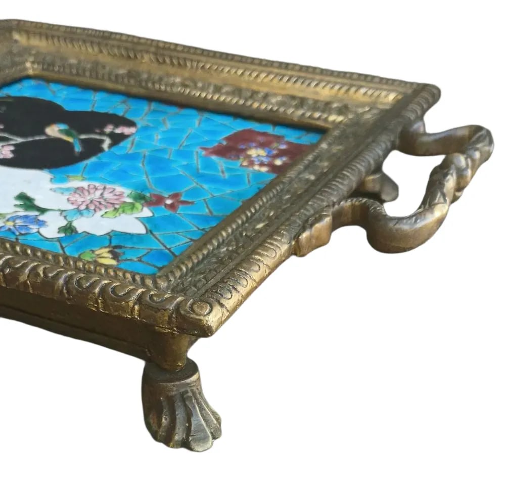 Longwy Tile Trivet: Brass trivet with 6” x 6” Longwy tile showing a bluebird resting amongst the cherry blossoms…unmarked…note the sea-creatures that support the handles…