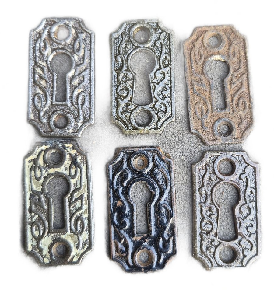 Six Keyhole Escutcheons: Six cast iron keyhole escutcheons...2" x 1.5"...not the one with original Jappaning...good as found...