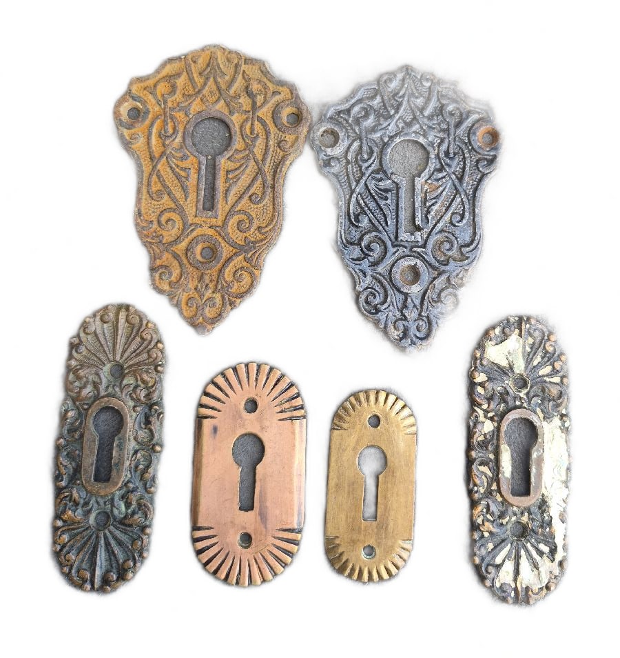 More Keyhole Escutcheons: Six decoraed keyhole escutcheons...the large ones are cat iron and measure 3.5" x 2.5"...all good as found