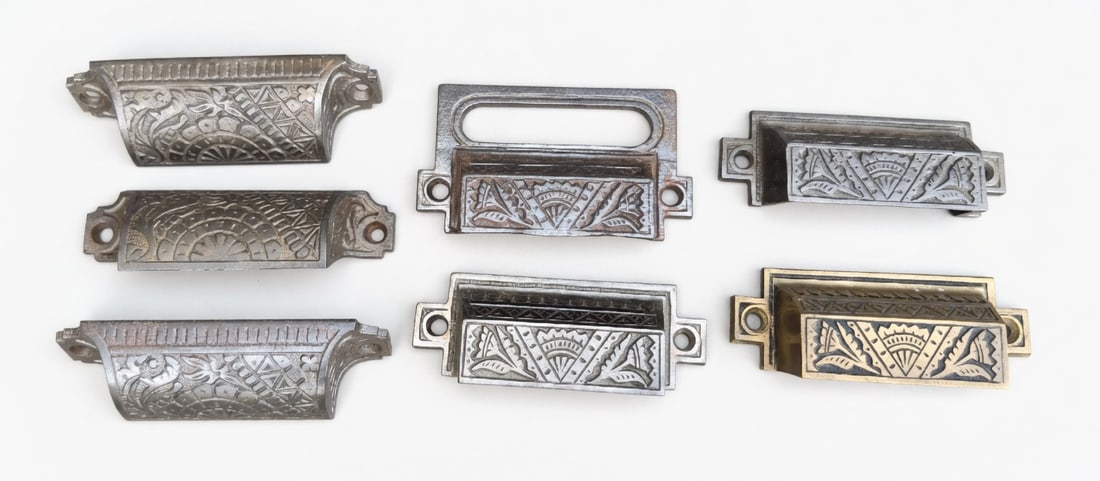 More Bin Pulls: One brass and six cast iron bin pulls...all c. 1880s...the laargest is 3.5" x 2"... and all in nice as found condition...