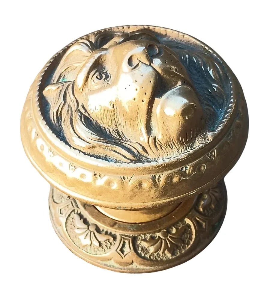 Important Lion Knob: Footed shank Lion entry knob...maker unknown but dating from the 1860s...cast in lead (see lots 78 and 97) and then brass plated...this was likely the model for the Kruzinger patented lion offered by