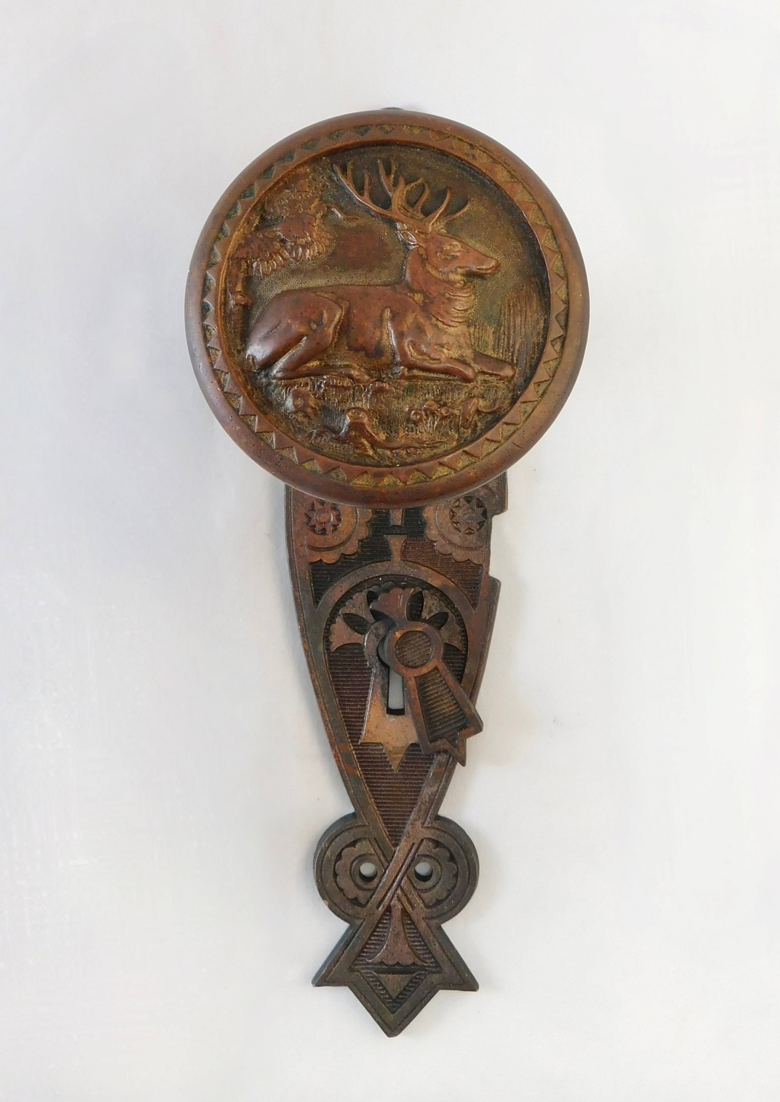 Stag At Rest: Cast bronze entry knob featuring a stag at rest in the forest, made by Corbin for the CT State Capitol c. 1878...along with the aoriginal door plate, 7.5" x 2" which has a repair on the reverse and a