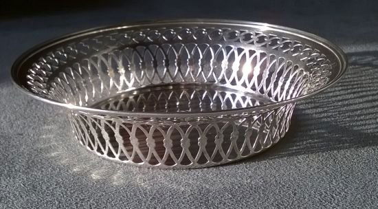 Stirling Wine Coaster: Sterling wine coaster, monogramed with 1888 P 1913 on the inside bottom, with a highly reticulated gallery, 5.25" top diameter and 3.5" bottom - will hold standard 750 ml bottle; 2.3 ozt, in excellent