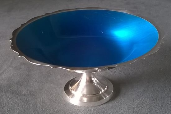 Enameled Silver Plate Dish: Well wrought silver plate footed dish with blue enamel interior. Dimensions are 3.5” x 65”. Marked “ Wm. Rogers”. Excellent condition.