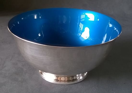 Large Silver Plate and Blue Enamel Bowl: Large silver plate bowl with blue enamel interior. Dimensions are 4” x 8”. Marked “Reed & Barton” and retaining the original paper label. Excellent condition.