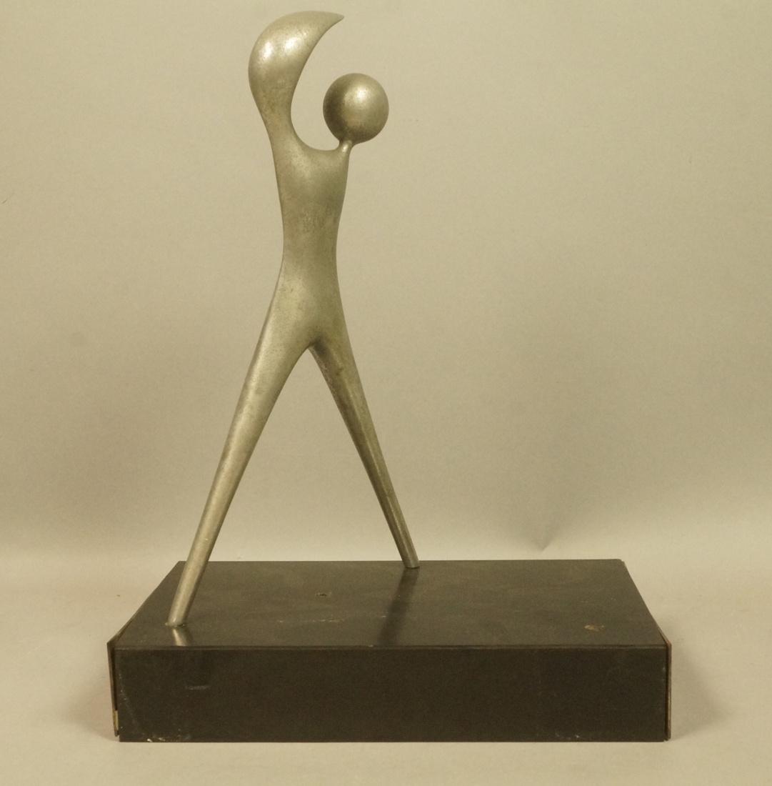 Modernist Figural Sculpture. Jean Arp style. Alum: Modernist Figural Sculpture. Jean Arp style. Aluminum form on laminated black base. Not marked.-- Dimensions: H: 13 inches: W: 10.25 inches: D: 6.75 inches ---