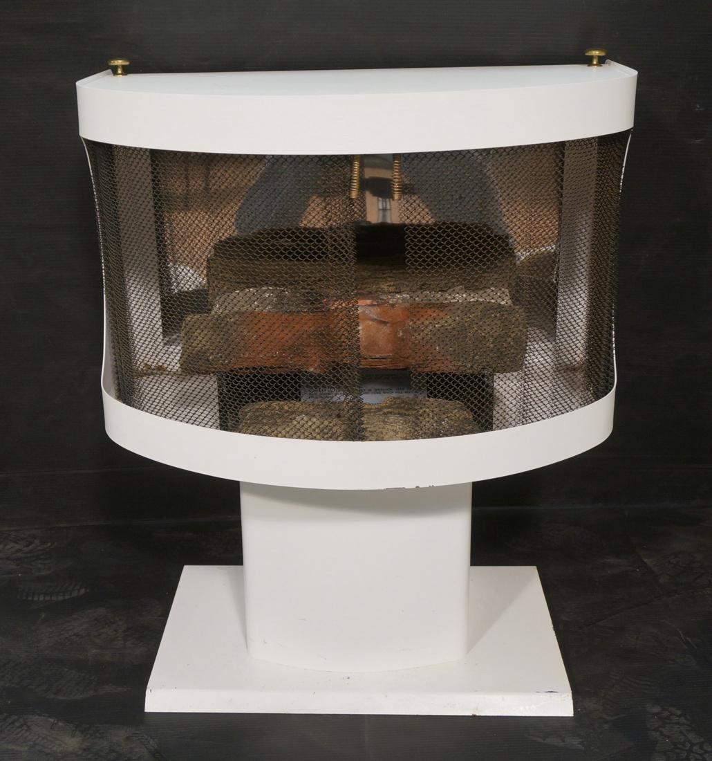 Modern White Metal Fireplace. Faux wood logs. Mir: Modern White Metal Fireplace. Faux wood logs. Mirror reflective metal back. Mastercraft Metal Inc. -- Dimensions: H: 33 inches: W: 28 inches: D: 15 inches ---