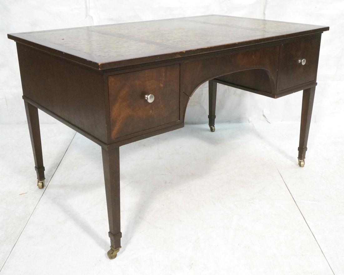 Unusual DUNBAR Partners Desk. Mahogany frame with: Unusual DUNBAR Partners Desk. Mahogany frame with oil spot leather top. Chrome pulls. Casters. Green metal DUNBAR tag-- Dimensions: H: 31.5 inches: W: 51 inches: D: 32 inches ---