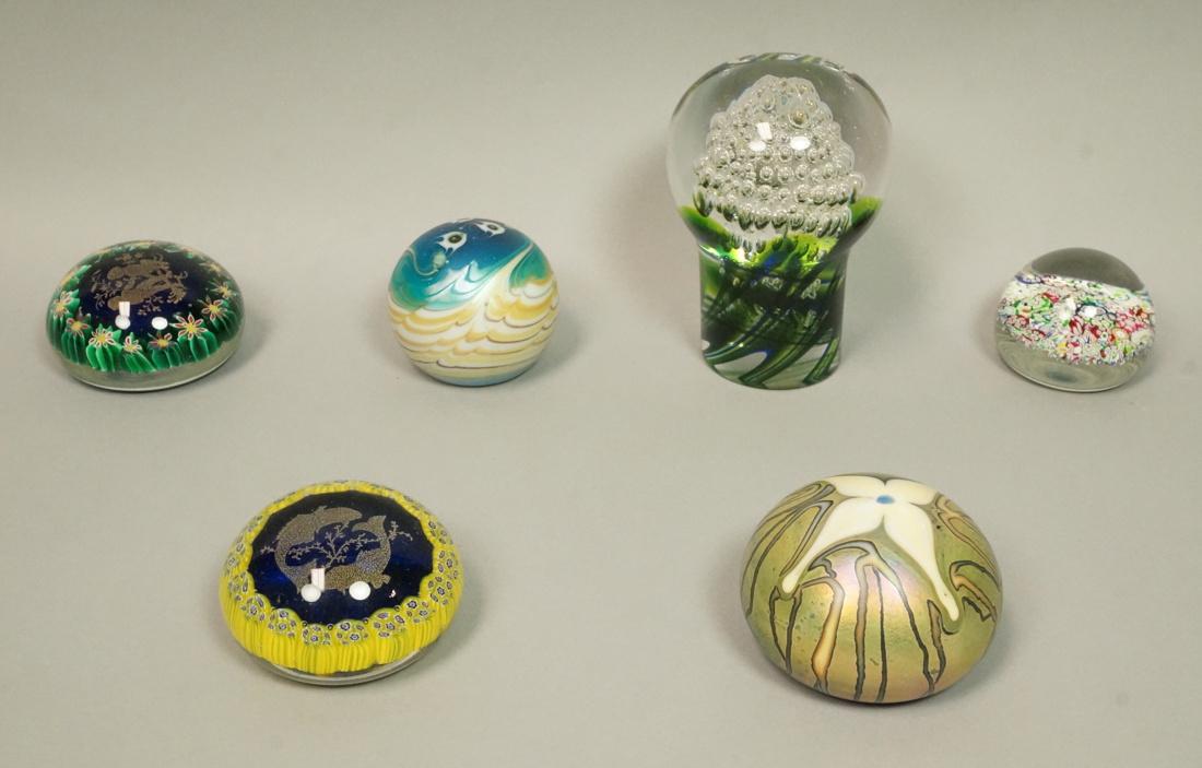 Lot 6 Art Glass Paper Weights. LUNDBERG STUDIOS 1: Lot 6 Art Glass Paper Weights. LUNDBERG STUDIOS 1977 Waves & Fish. Unmarked cobalt body with red and white flowers and gold children. Large KOSTA by GORAN WARFF internal bubble design. Iridescent with