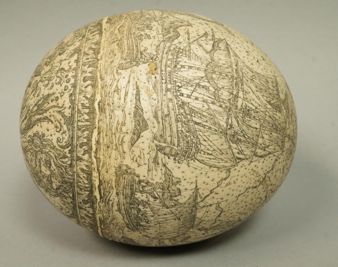 Hollow Ostrich Egg with Engraved Marine Seascape.: Hollow Ostrich Egg with Engraved Marine Seascape. Whale hunt. Large sailing ship with whale. Scrimshaw.-- Dimensions: H: 5.5 inches: W: 4.75 inches: D: 4.75 inches --- US Shipping charge: $20