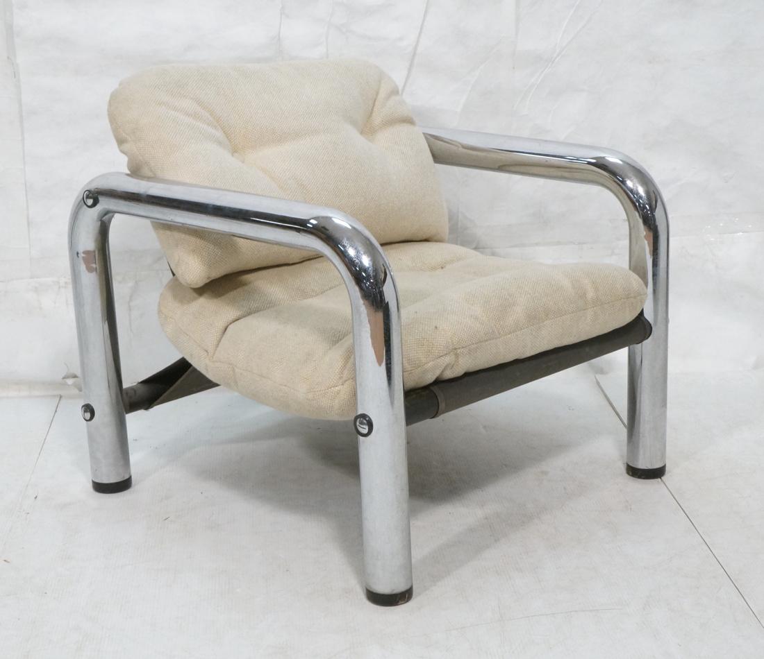 Chrome Thick Tube Lounge Chair. Curved Modernist: Chrome Thick Tube Lounge Chair. Curved Modernist Frame. Beige upholstery. Ebonized Wood Feet-- Dimensions: H: 30 inches: W: 33 inches: D: 33 inches ---