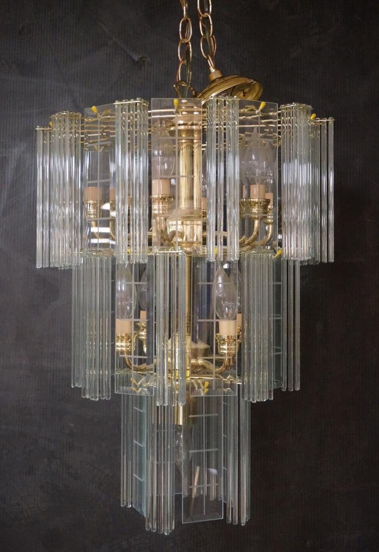 Brass & Glass Modernist Chandelier Hanging Light.: Brass & Glass Modernist Chandelier Hanging Light. 3 tier form with beveled glass panels and glass rods. Glass is coke bottle green. Actual chandelier is 24"H x 14" diameter.-- Dimensions: ---