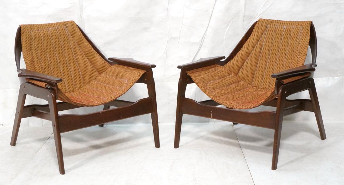 Pr Modernist Sling Seat Lounge Chairs. Dark wood: Pr Modernist Sling Seat Lounge Chairs. Dark wood frame with shaped arms. Sling fabric seat and back. Pearsall Style.-- Dimensions: H: 30 inches: W: 30.5 inches: D: 28 inches ---