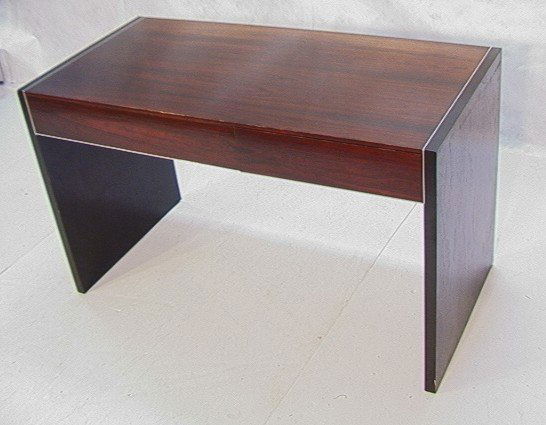 JOHN STUART Rosewood Desk Vanity. Ebonized sides.: JOHN STUART Rosewood Desk Vanity. Ebonized sides. Wood Self Pulls. Chrome Banding Trim around drawers and between top and legs. Metal John Stuart Inc. Dimensions: H: 29 inches: W: 50 inches: D: 24 inc