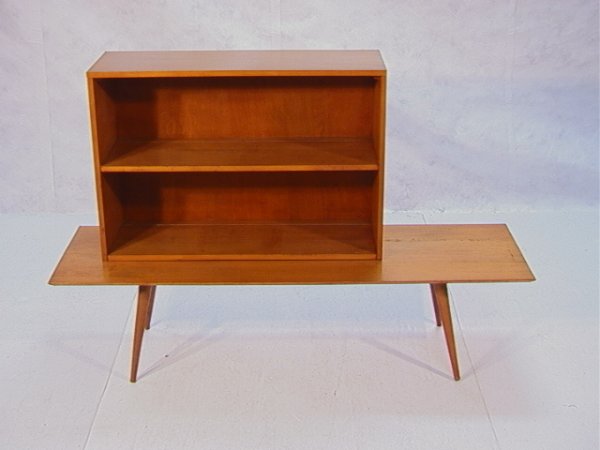 PAUL MCCOBB Planner Group Coffee Table Bookcase. T: PAUL MCCOBB Planner Group Coffee Table Bookcase. Two shelf top over tapered leg base. Mccobb foil label. Dimensions: H: 39 inches: W: 60 inches: D: 18 inches Condition: Very good condition with some s