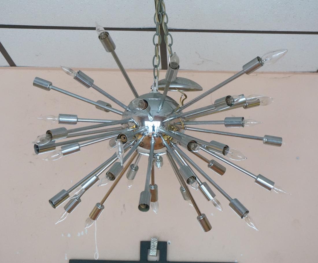 Modernist 70s Cosmic Sputnik Hanging Chandelier.: Modernist 70s Cosmic Sputnik Hanging Chandelier. Chrome sphere with multiple chrome rod arms. Some light spots and pitting to metal. Needs bulbs.-- Dimensions: H: 36 inches: W: 25 inches: D: 25 inches