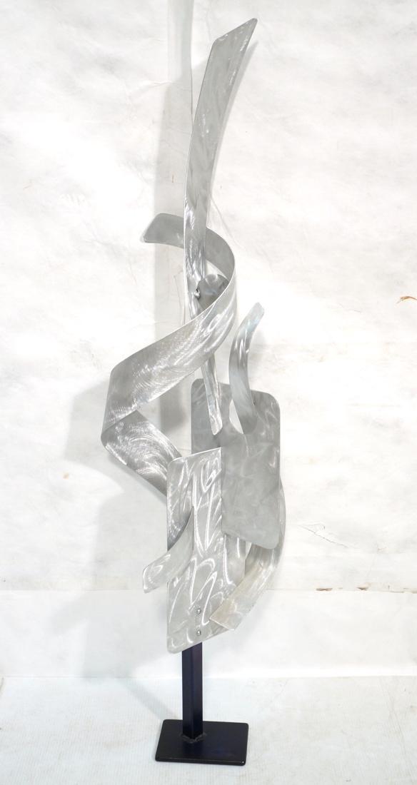 David Smith style Steel Table Sculpture. ALEX KOV: David Smith style Steel Table Sculpture. ALEX KOVACS Signed, 2006. Multiple elements with engine turned finish. Black metal base.-- Dimensions: H: 54.5 inches: W: 15 inches: D: 15 inches ---