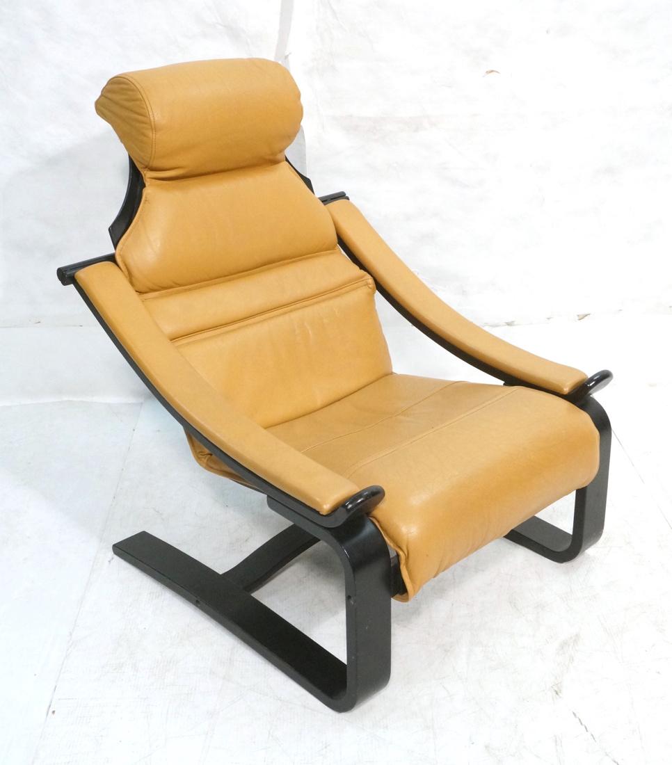 Caramel Leather Modern Lounge Chair. Wide ebonize: Caramel Leather Modern Lounge Chair. Wide ebonized wood frame. Not marked-- Dimensions: H: 40 inches: W: 28 inches: D: 30 inches ---