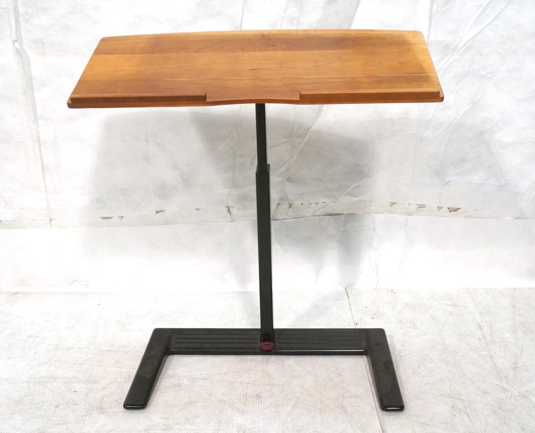 HERMAN MILLER Podium. Black Metal Base with Wood: HERMAN MILLER Podium. Black Metal Base with Wood Tray top. Adjustable height. Marked-- Dimensions: H: 31 inches: W: 28 inches: D: 14 inches ---