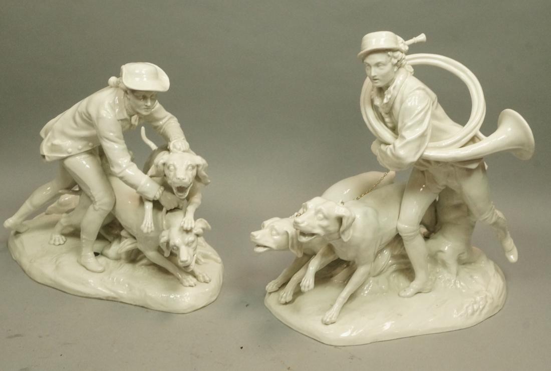 2 Royal Vienna Ceramic Figural Sculptures. 1) Man: 2 Royal Vienna Ceramic Figural Sculptures. 1) Man in tri-corner hat with 2 fierce hunting dogs. 2) Man with large horn with two hunting dogs on leashes. Both marked with blue beehive mark.-- Dimension