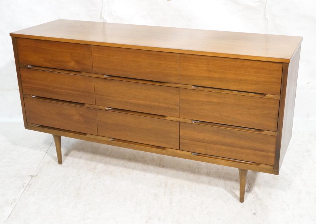 American Modern Walnut 9 Drawer Credenza Dresser.: American Modern Walnut 9 Drawer Credenza Dresser. Recessed horizontal pulls, raised on tapered peg legs.-- Dimensions: H: 31 inches: W: 58.25 inches: D: 18 inches ---