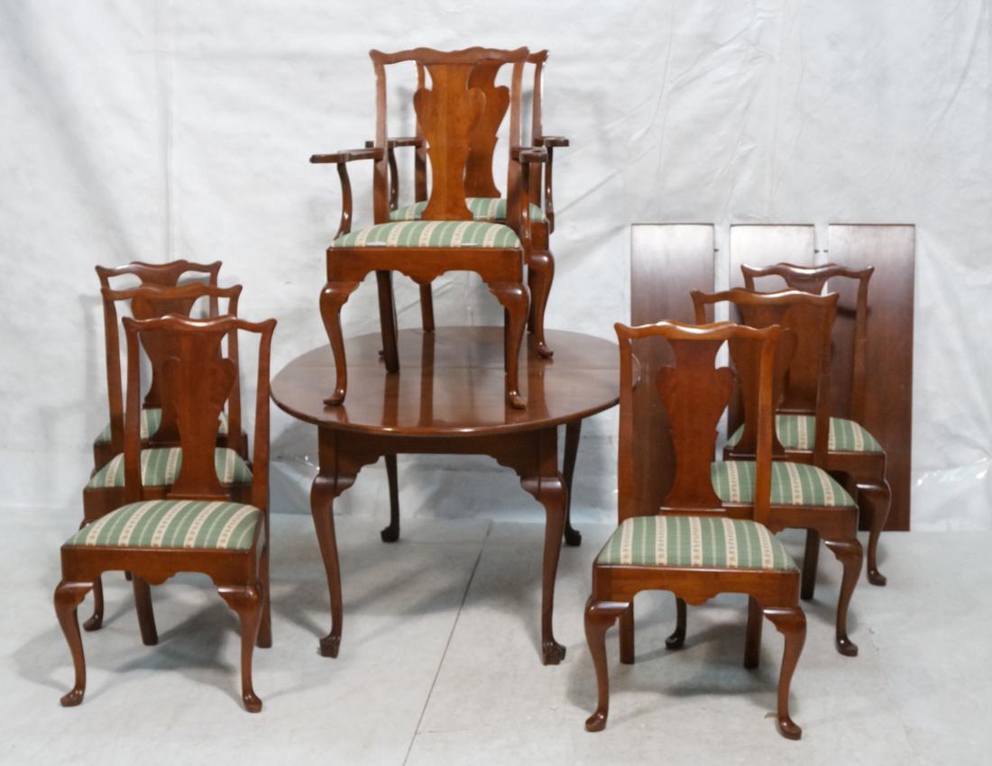Cherry Dining Table & 8 Chairs. 2 arm and 6 side: Cherry Dining Table & 8 Chairs. 2 arm and 6 side chairs with shaped back splats. Table and chairs with Queen Anne cabriole legs. Three 12" leaves.-- Dimensions: H: 29.25 inches: W: 63 inches: D: 43.5
