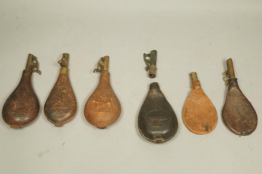 6 Vintage Embossed Leather Powder Flasks. Most wi: 6 Vintage Embossed Leather Powder Flasks. Most with embossed hunting or hunting dog design. Metal or brass mounting.-- Dimensions: H: 8.5 inches: W: 3.5 inches --- US Shipping charge: $35