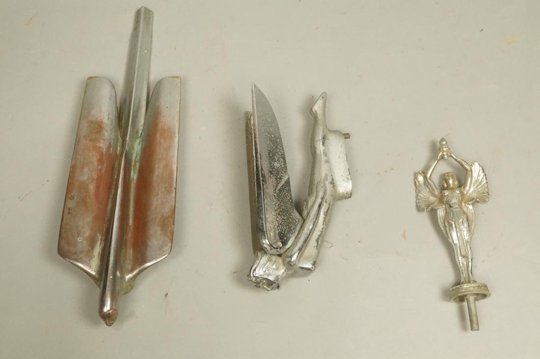 3 Vintage Car Mascot Hood Ornaments. Winged semi: 3 Vintage Car Mascot Hood Ornaments. Winged semi nude woman holding torch marked Y.F.H. Noble & Co; Winged female nude, Art Deco. Not marked.; Large Art Deco winged female, marked with 1456358.-- Dime