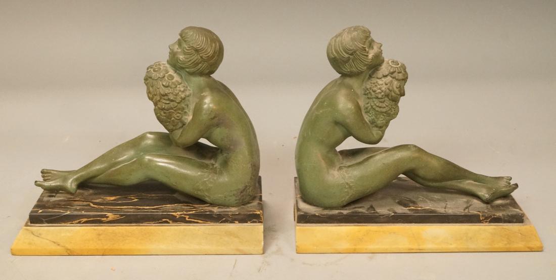 Pr French Art Deco Figural Nude Female Book Ends.: Pr French Art Deco Figural Nude Female Book Ends. White metal flapper style woman with green patina. Stepped 2 tone marble base. Bronze fabrication Francaise Paris stamp.-- Dimensions: H: 7 inches: W: