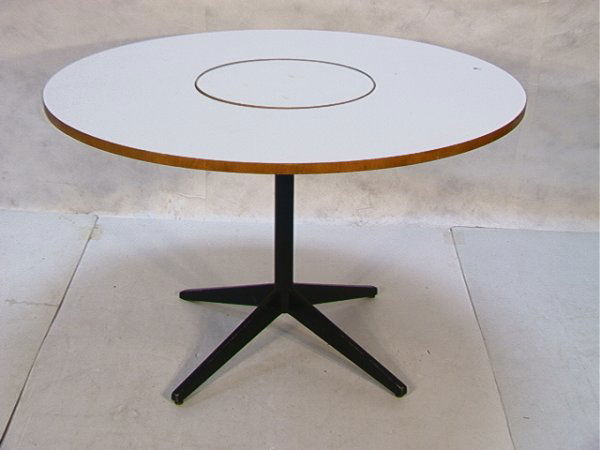 George Nelson Herman Miller Dining Table Lazy Susa: George Nelson Herman Miller Dining Table Lazy Susan Center. White Formica top over black metal base. Unmarked. Dimensions: H: 29 inches: W: 47.5 inches Condition: Lazy Susan center is tight but does m