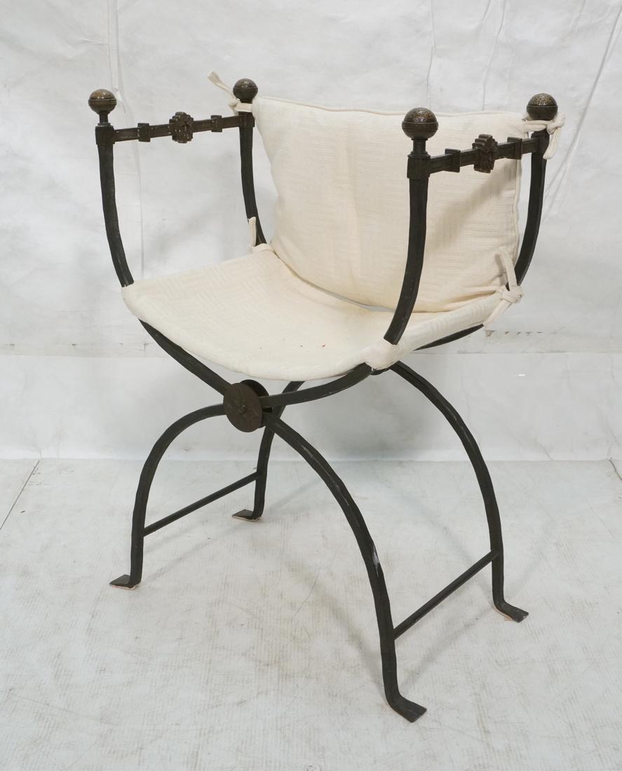 Wrought Iron Savonarola Chair. Black iron with Ha: Wrought Iron Savonarola Chair. Black iron with Hammered bronze finials and north wind face decorations. White on white textured fabric. -- Dimensions: H: 32 inches: W: 23 inches: D: 14.5 inches ---