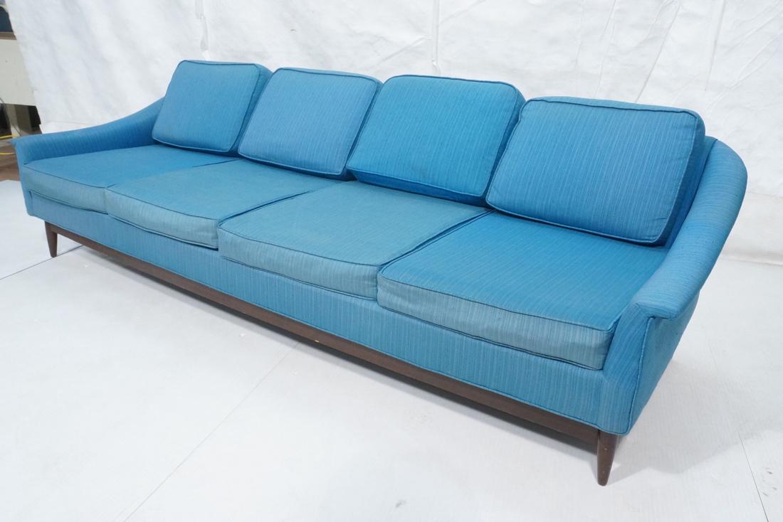 SELIG Monroe Blue Upholstered Modern Sofa Couch.: SELIG Monroe Blue Upholstered Modern Sofa Couch. Long horizontal profile, gently sloped arms. Striped blue fabric. Dark wood peg legs and skirt. Has label.-- Dimensions: H: 28.5 inches: W: 97 inches: