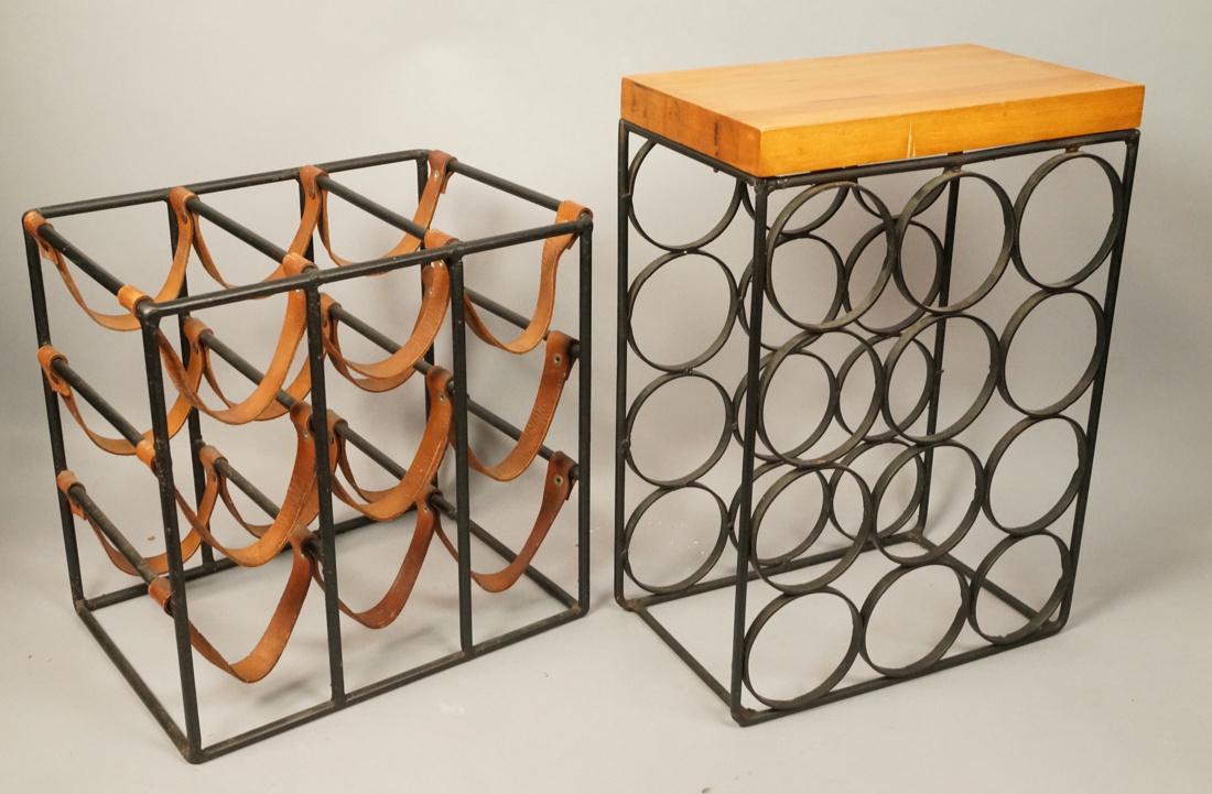 2 Black Iron Modern Wine Racks. ARTHUR UMANOFF St: 2 Black Iron Modern Wine Racks. ARTHUR UMANOFF Style with leather bottle straps. Stand form with wood top. -- Dimensions: H: 18 inches: W: 12.75 inches: D: 8 inches ---