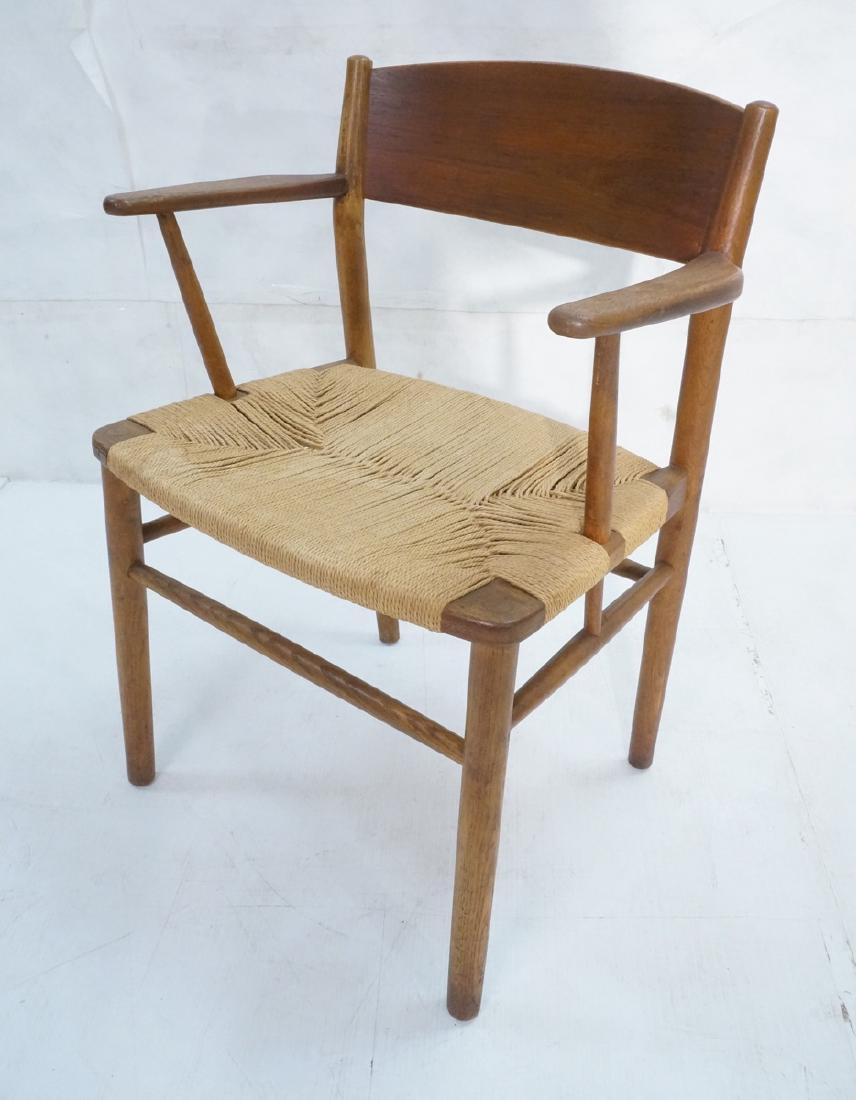 Borge Mogensen Rush Seat Modern Arm Chair. Bowed: Borge Mogensen Rush Seat Modern Arm Chair. Bowed back rest and small paddle arms. Woven rush seat. Not marked.-- Dimensions: H: 30.5 inches: W: 23 inches: D: 20 inches ---
