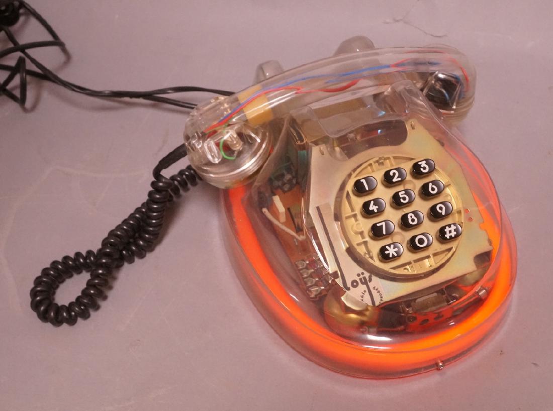 LOYS French Lucite Neon Telephone. 1986. Clear lu: LOYS French Lucite Neon Telephone. 1986. Clear lucite body lights up. All mechanics & "Body parts" are visible. Marked-- Dimensions: H: 6 inches: W: 9 inches: D: 10 inches --- US Shipping charge: $35