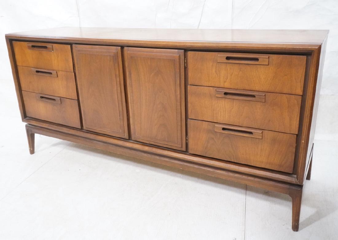 American Modern Walnut Credenza Sideboard. Mid ce: American Modern Walnut Credenza Sideboard. Mid century dresser raised on legs. -- Dimensions: H: 31.25 inches: W: 66 inches: D: 19 inches ---