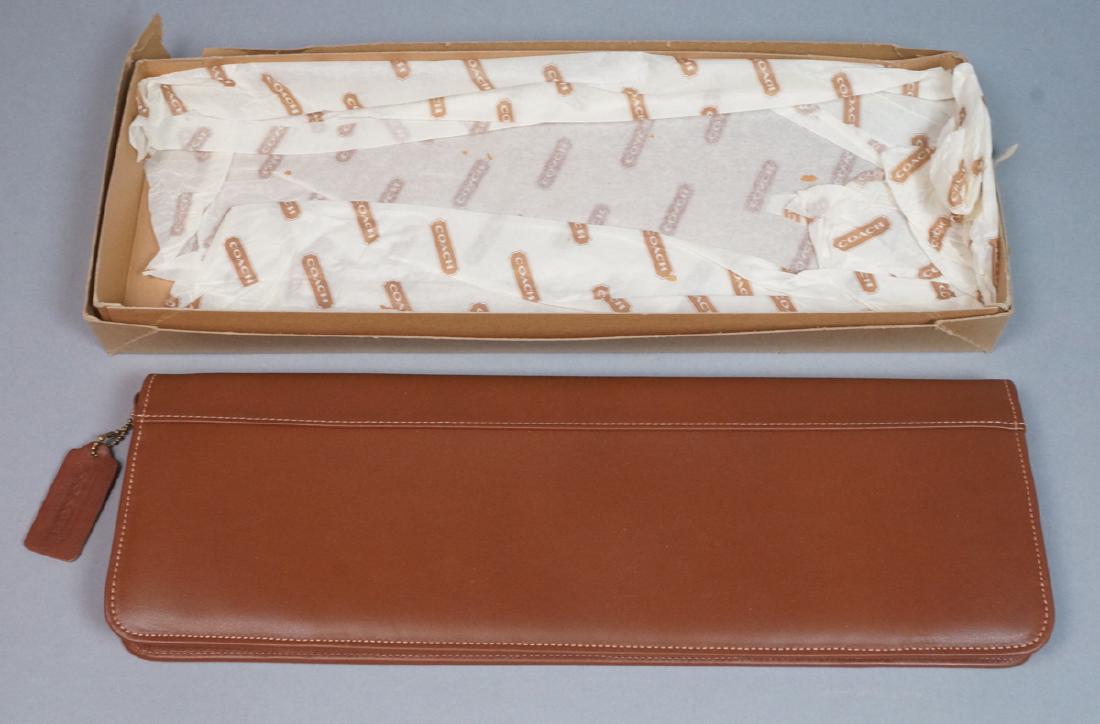 COACH Tan leather Tie Case. New in gift box with: COACH Tan leather Tie Case. New in gift box with tag and coach tissue paper. Coach hang tag.-- Dimensions: H: 16 inches: W: 5.75 inches --- US Shipping charge: $20