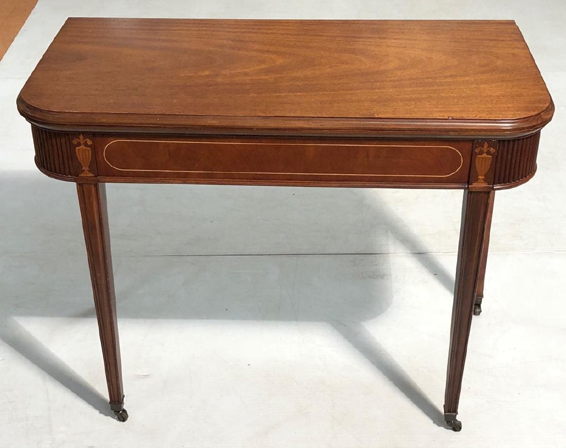 Antique Sheraton Style Flip Top Game Table. Exte: Antique Sheraton Style Flip Top Game Table. Extension table with Inlaid urns. -- Dimensions: H: 30.5 inches: W: 40 inches: D: 20.25 inches ---