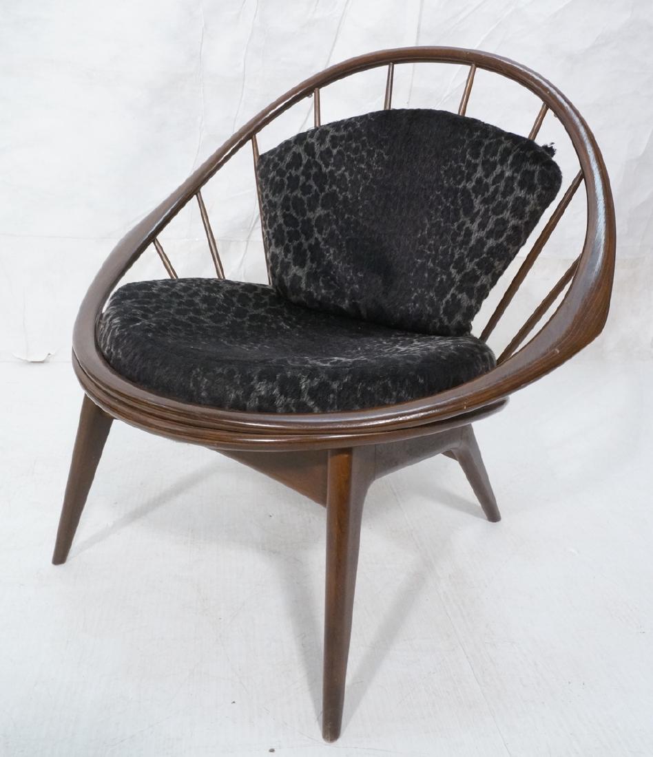 Kofod Larsen Open Hoop Frame Modern Lounge Chair.: Kofod Larsen Open Hoop Frame Modern Lounge Chair. Selig. Laminated wood circle with tapered dowel back. American Modern. Black animal print plush seat and back cushions. Unmarked.-- Dimensions: H: 32.