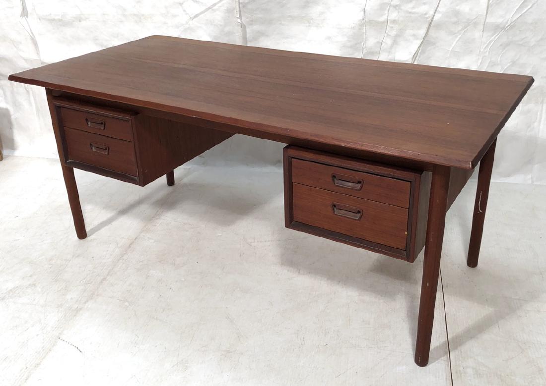 Danish Modern Teak Desk. Beveled edge top above a: Danish Modern Teak Desk. Beveled edge top above a pair of double drawer cabinets. Thick dowel legs. -- Dimensions: H: 28.5 inches: W: 65 inches: D: 31.25 inches ---