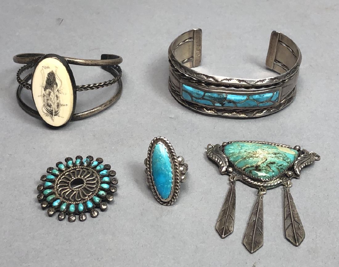5pc Native American Indian Jewelry. 1) turquoise: 5pc Native American Indian Jewelry. 1) turquoise pendant w 3 feather dangles, marked AT 2) wide cuff bracelet with inlaid turquoise, not marked. 3) JM Oval turquoise ring. 4)Signed Zuni needlepoint pi