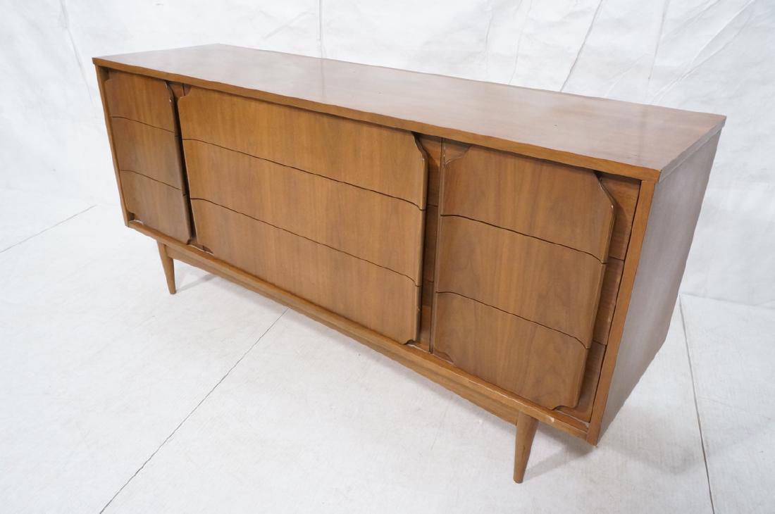 American Modern Walnut Credenza. 9 drawers with s: American Modern Walnut Credenza. 9 drawers with stylish sculptural pulls. Raised on peg legs. -- Dimensions: H: 30.25 inches: W: 64 inches: D: 18 inches ---