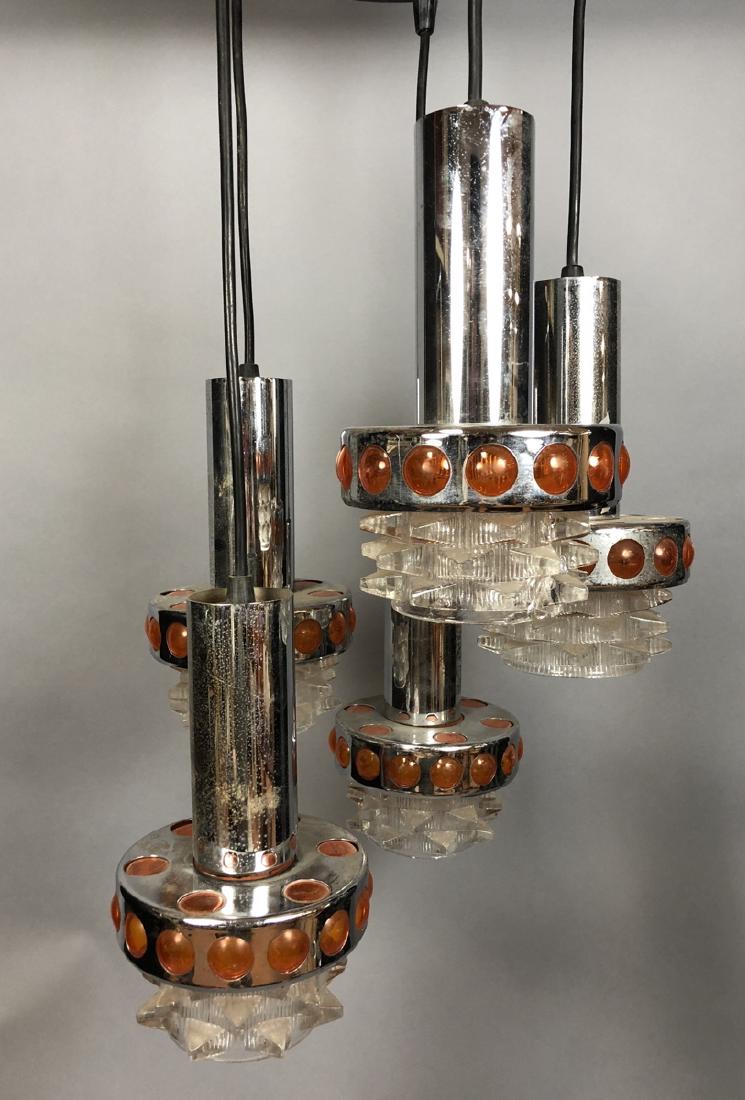 Modernist Chrome Orange Hanging Chandelier. 5 han: Modernist Chrome Orange Hanging Chandelier. 5 hanging chrome pendants with orange and clear glass elements. Black ceiling mount.-- Dimensions: H: 28 inches: W: 12 inches: D: 14 inches ---