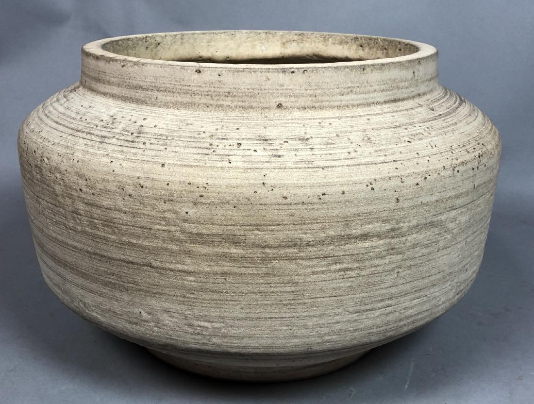Pottery Modernist Planter. Squat Form Cream body: Pottery Modernist Planter. Squat Form Cream body with slightly ribbed surface. Design Technics Style. Not Marked-- Dimensions: H: 10.5 inches: W: 16 inches: D: 16 inches ---