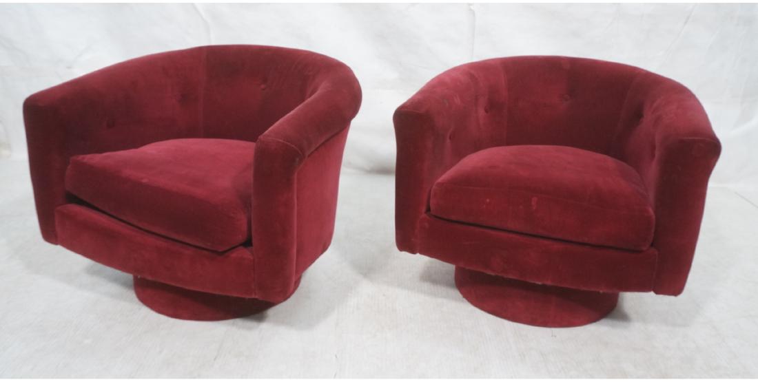 Pr MILO BAUGHMAN Style Barrel Back Lounge Chairs.: Pr MILO BAUGHMAN Style Barrel Back Lounge Chairs. Modernist swivel chairs in burgundy wine upholstery. Matching tall platform base. Not marked.-- Dimensions: H: 25.5 inches: W: 29 inches: D: 29 inches