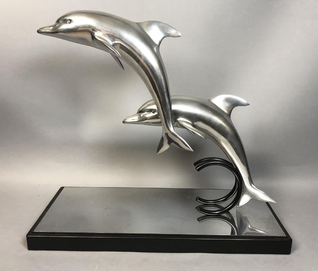 Modernist Aluminum Jumping Dolphin Sculpture. Bl: Modernist Aluminum Jumping Dolphin Sculpture. Black Painted base.-- Dimensions: H: 21 inches: W: 24.5 inches: D: 10.5 inches ---