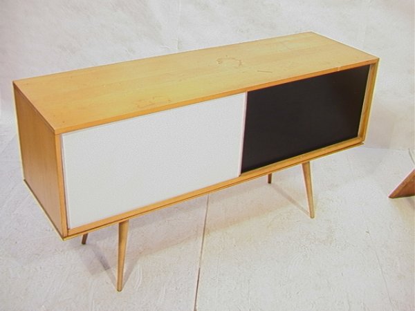 Paul McCobb Winchendon Planner Group Cabinet Crede: Paul McCobb Winchendon Planner Group Cabinet Credenza with sliding Doors. Doors are reversible black or white. Branded. Dimensions: H: 31 inches: W: 18 inches: L: 60 inches Condition: Good condition.