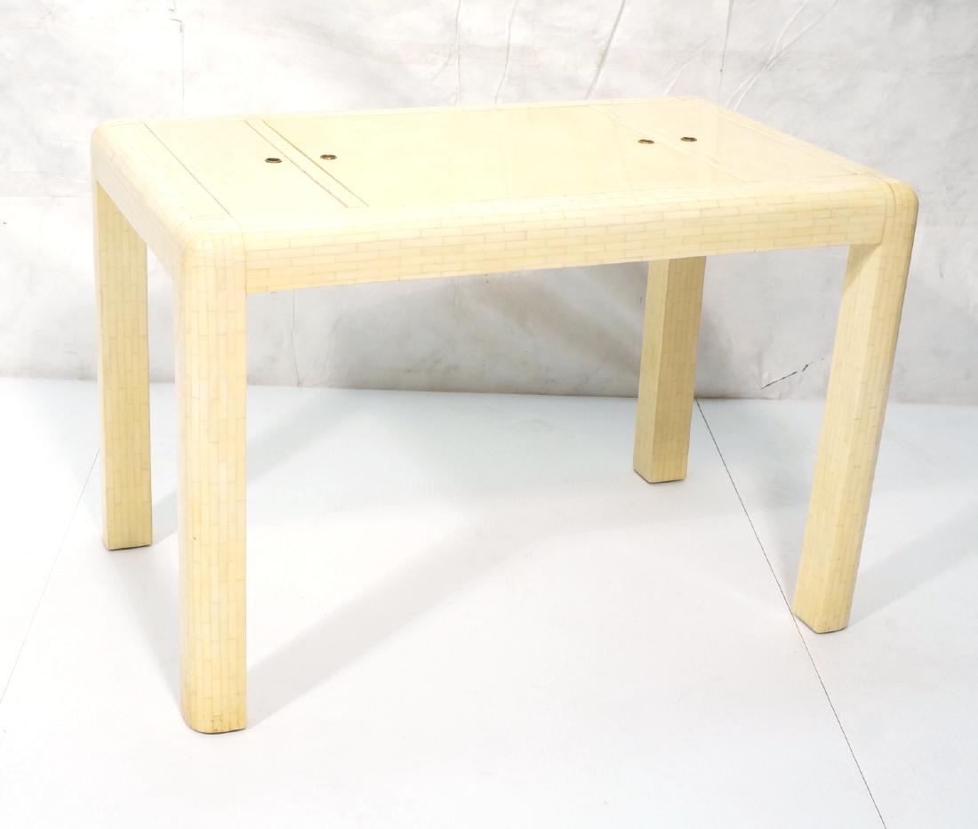 Bone Colored Tessellated Lacquered Game Table. Re: Bone Colored Tessellated Lacquered Game Table. Reversible top has 'ivory' tessellation or horn checkerboard. 2 hinged side storage compartments. Backgammon board. Enrique Garcel Style. -- Dimensions: