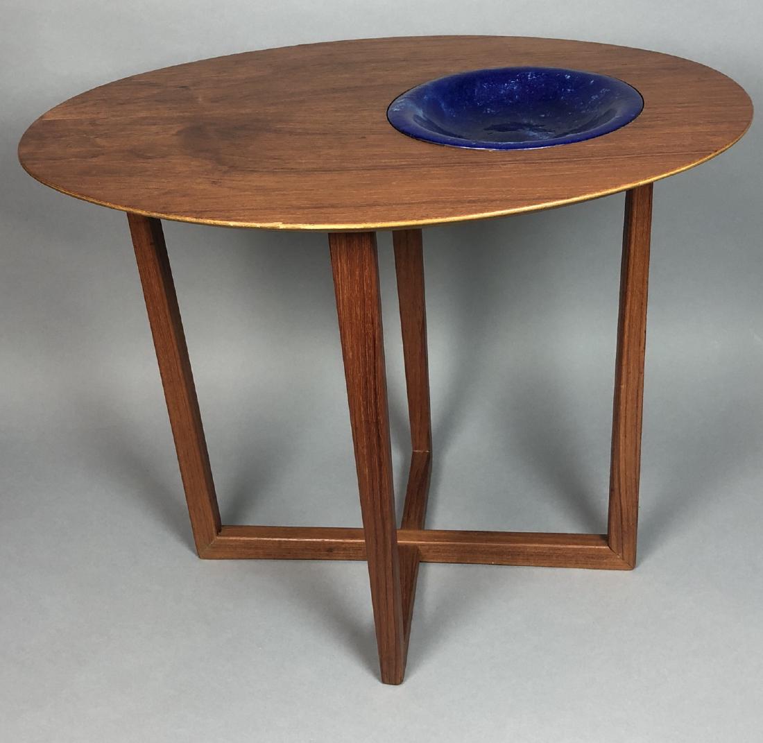 SELIG Danish Modern Teak Oval Side Table Enamel A: SELIG Danish Modern Teak Oval Side Table Enamel Accent. Blue enameled copper bowl sits in recessed area of table top. Square teak legs with bisecting base design. Selig metal tag.-- Dimensions: H: 19