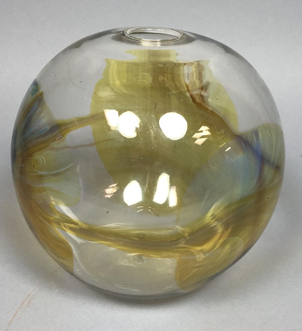 PETER BRAMHALL Studio Art Glass Vase. Spherical c: PETER BRAMHALL Studio Art Glass Vase. Spherical clear glass form with amber and moonstone colored details. Has pontil mark. Signed Bramhall 12/16/80. English studio glass blower.-- Dimensions: H: 8 in